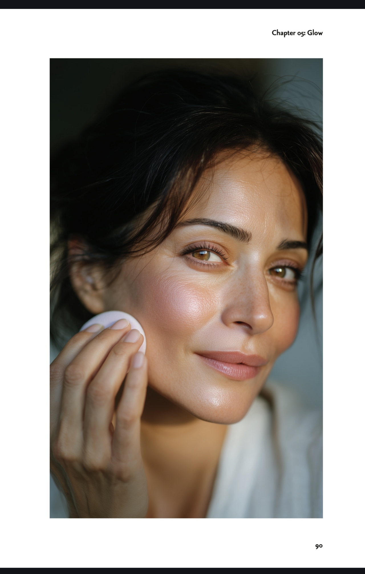 A woman enjoying a moment of self-care while applying make-up
